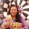 tarot card reader in hyderabad Tarot card reader with vibrant backdrop.